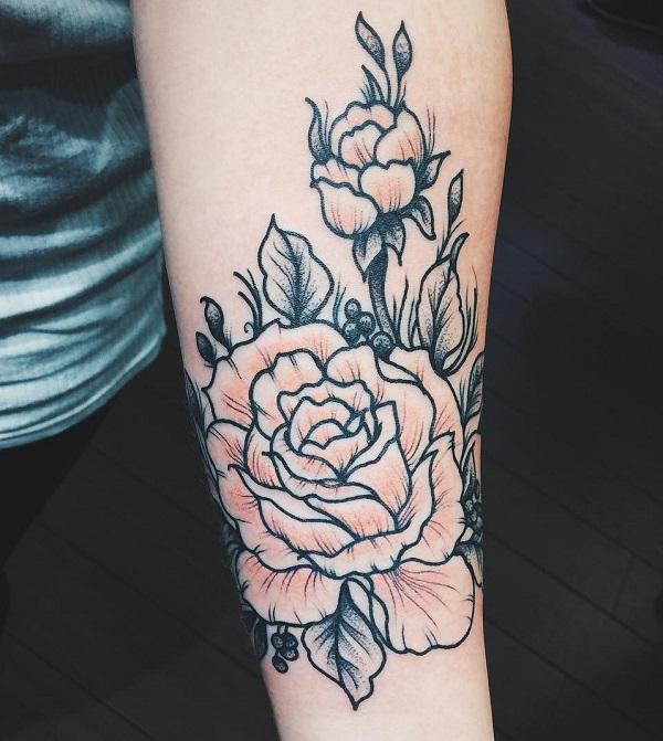 Pink rose sketch tattoo på underarm