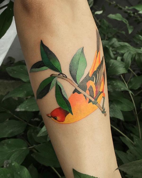 fantastisk-fugl-og-blade-tatovering-97