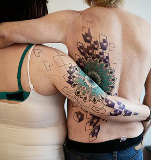 Fantastisk 3D par tatovering på arm og ryg