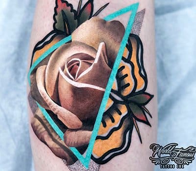 Kuva: Chris Rigoni Se on niin mieleenpainuva, että se ansaitsi paikan #1 sekoitetyyppisten tatuointien luettelossamme. Tässä on samanlainen väriteema sekoitettuna realismiin ja perinteiseen.